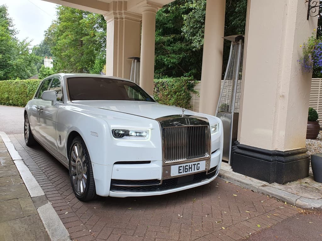 Rolls-Royce Phantom at hotel entrance — prestige arrival